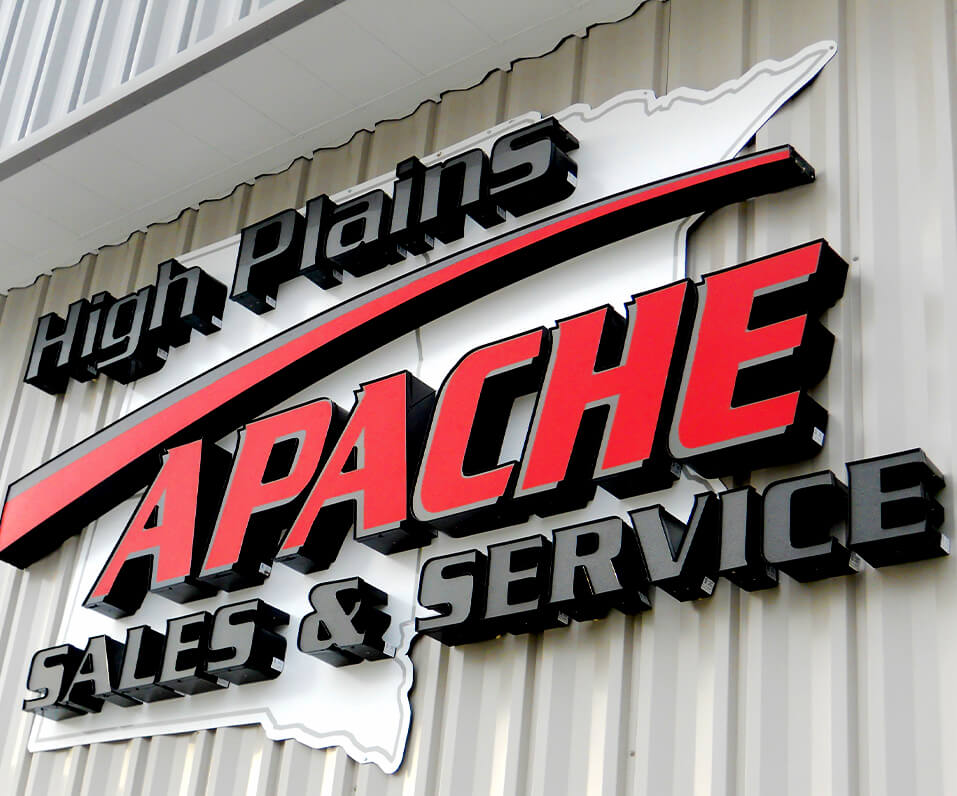High Plains Apache Sales and Service Channel Letters with custom shaped backer panel on Building Bismarck, ND