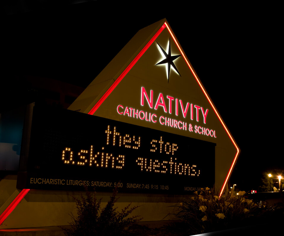 Nativity Catholic Church monument sign and night with edge lighting and digital display